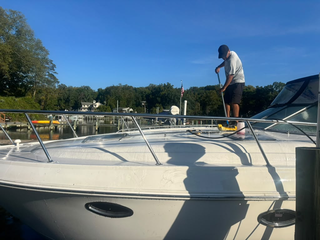 Boat deck receiving exterior care at the dock