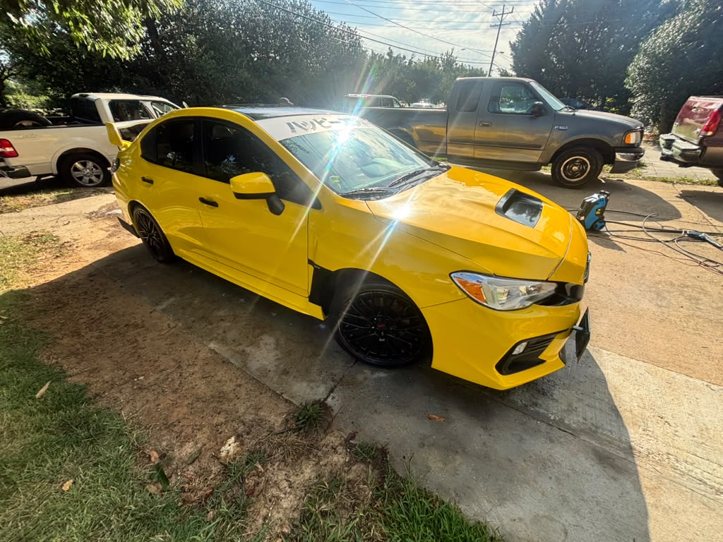 Yellow Subaru after exterior mobile detailing